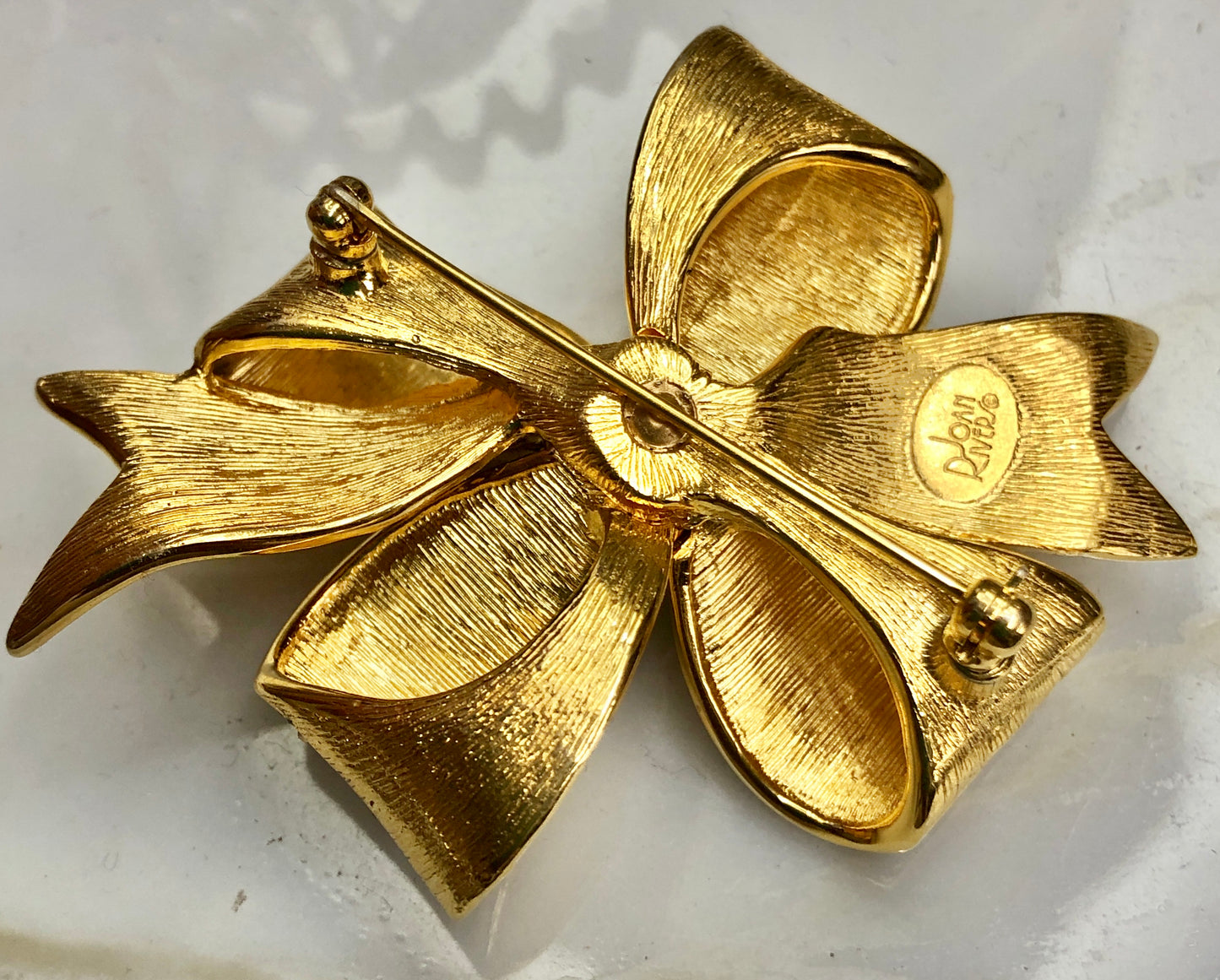 Vintage Signed Joan Rivers Enamel on Carved Metal Ribbon Brooch